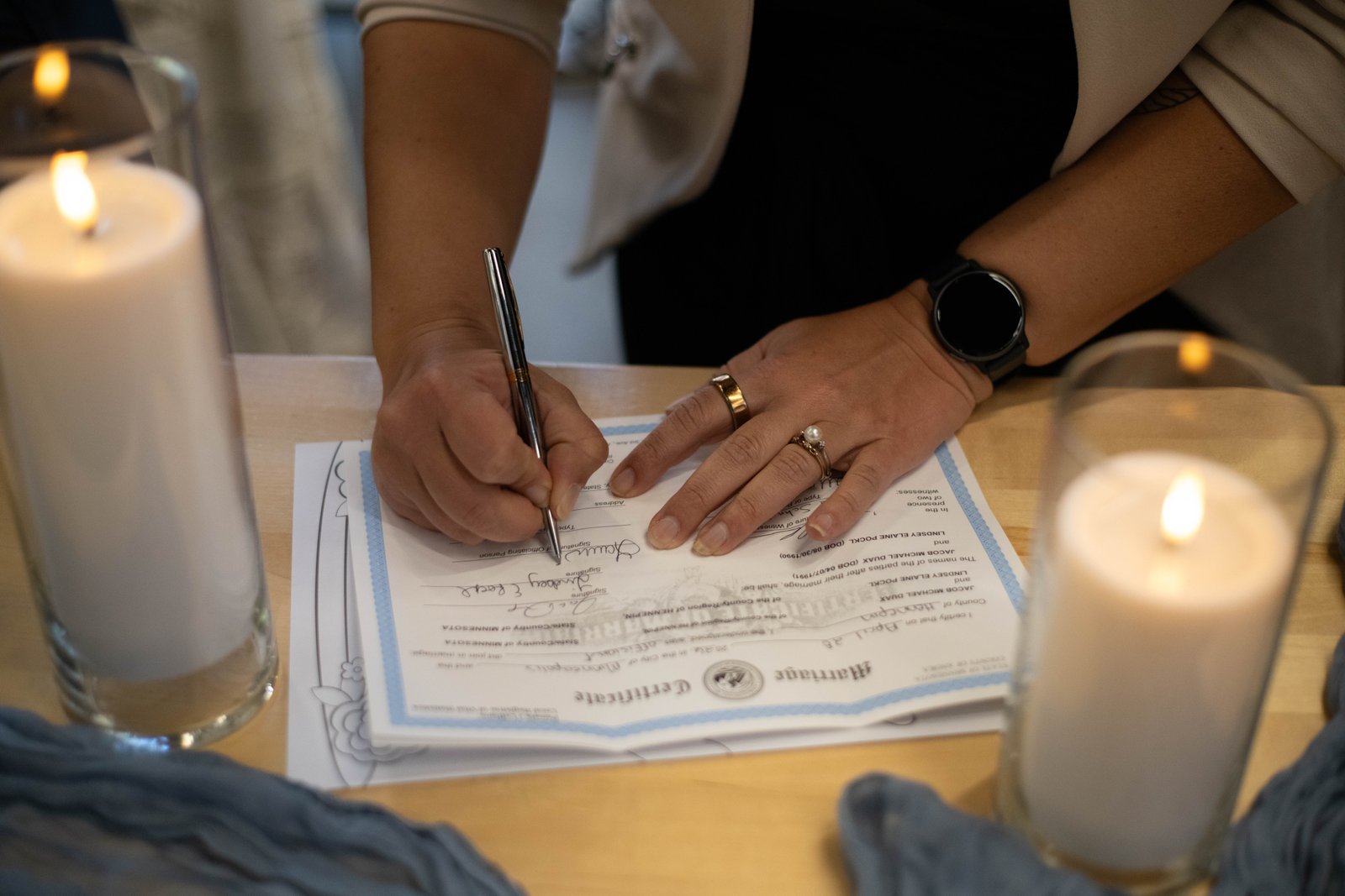 Signing the marriage certificate - documentary wedding photography Minneapolis